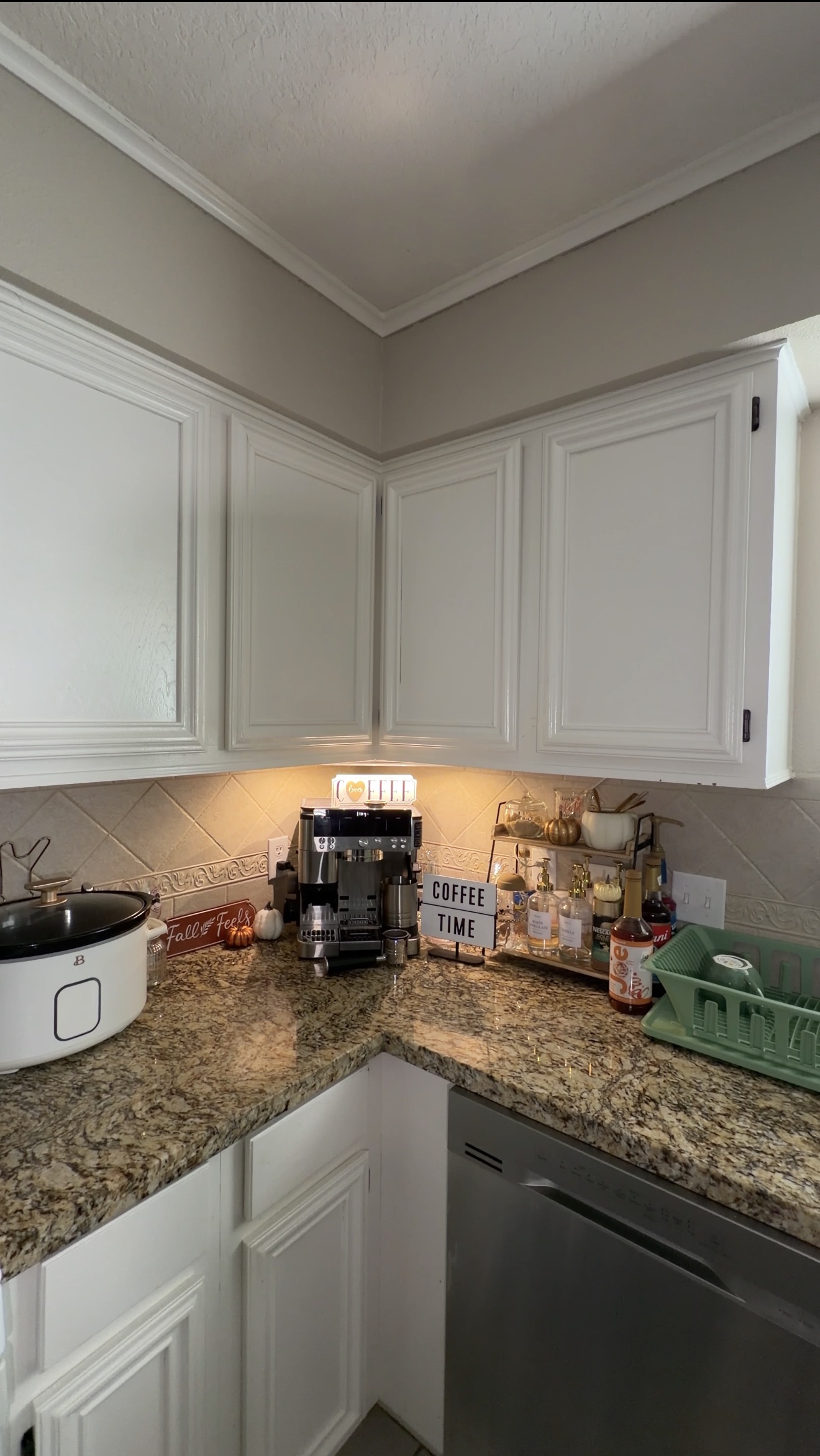 Wide shot of a kitchen coffee station showing the full scene
